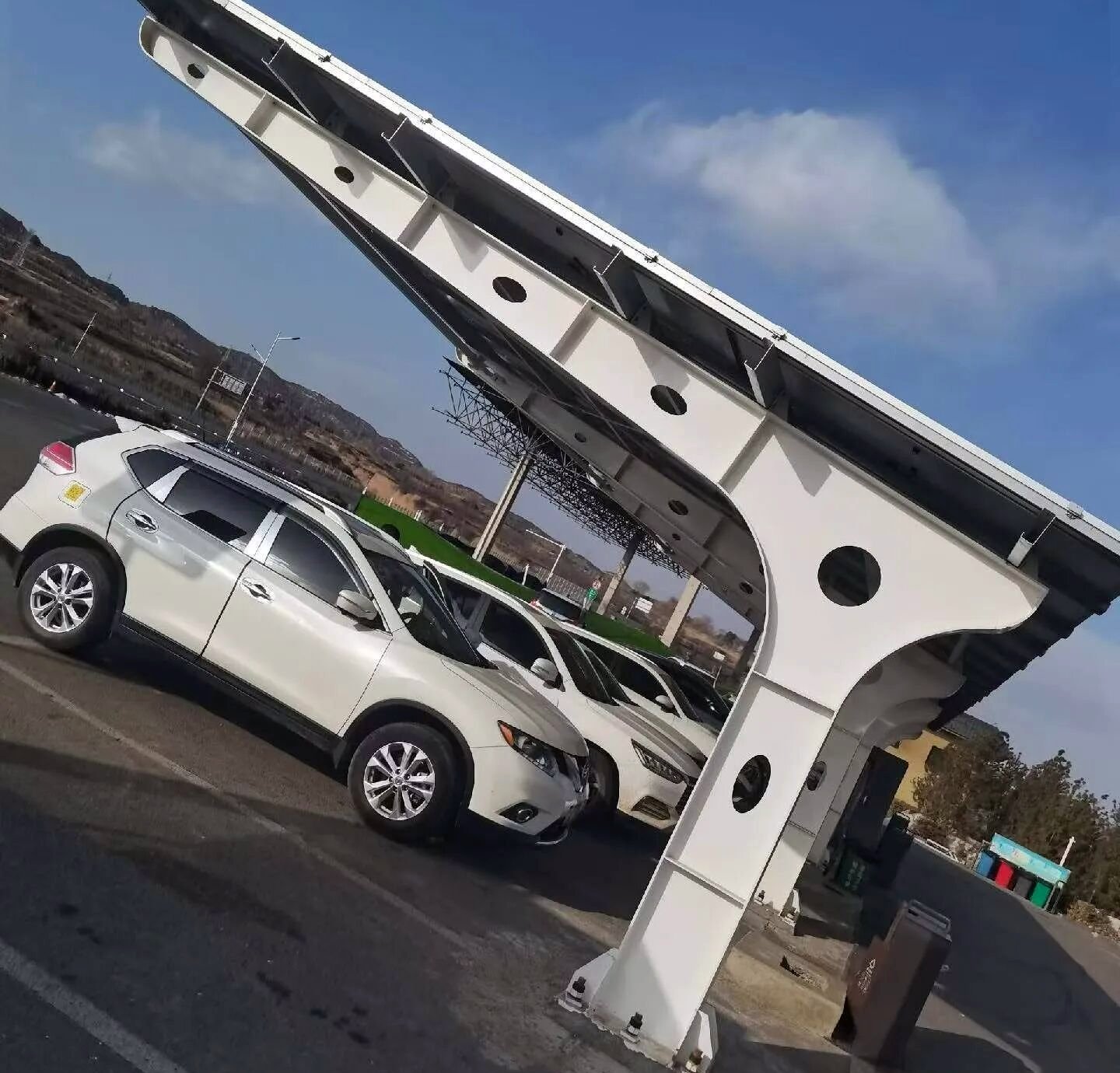 Single-side cantilever carport with a parked SUV